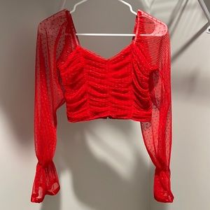 You can never miss a red top. Beautiful red brilliant top.